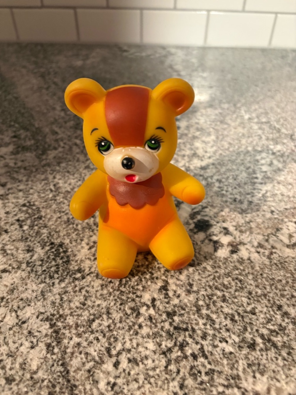 Vintage yellow rubber squeak toy bear